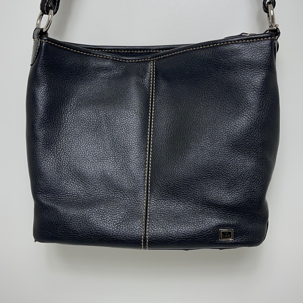 The SAK black pebbled leather crossbody purse silver hardware